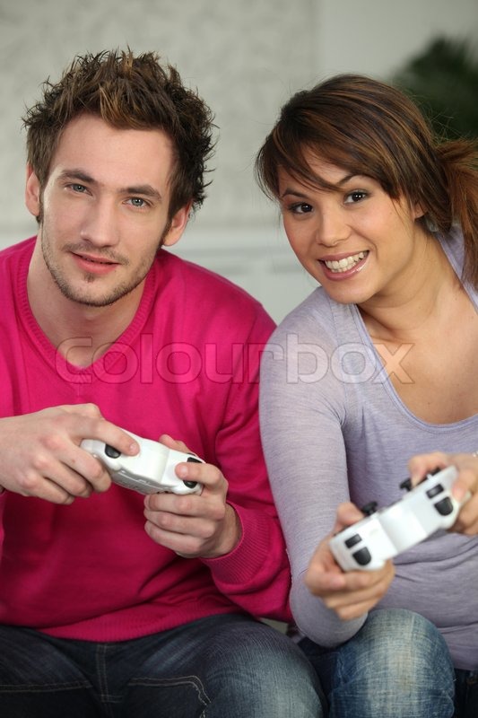 cutcaster-photo-100751868-Hispanic-Couple-Playing-Video-game