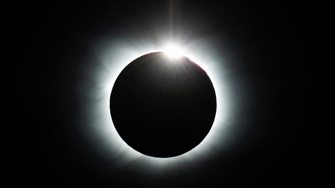 A breathtaking solar eclipse.  He was watched by flocks of penguins and a handful of people