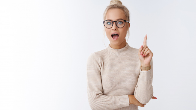 she-got-excellent-idea-indoor-shot-enthusiastic-creative-young-female-designer-adding-suggestion-raising-index-finger-eureka-gesture-open-mouth-say-plan-posing-white-background