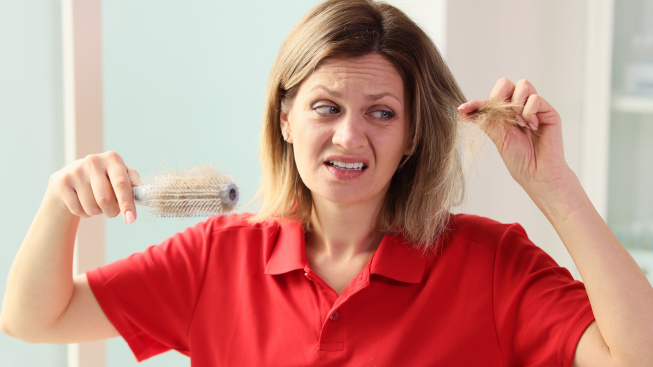 unhappy-woman-with-hairbrush-hand-looking-her-hair-hair-weakness-hairloss-health