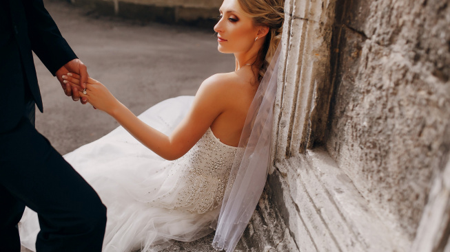bride-sitting-stone-bench