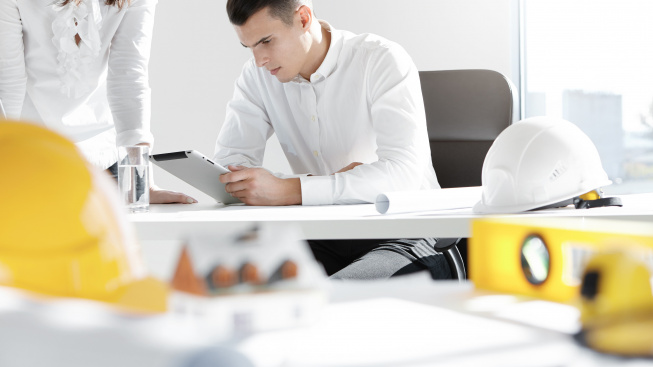 two-engineers-designers-working-construction-project