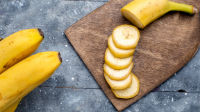 top-closer-view-fresh-yellow-bananas-sliced-whole-grey