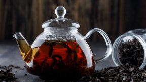black-tea-with-dry-tea-teapot-wooden-surface-side-view