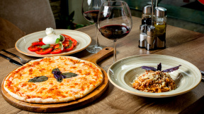dinner-set-with-margherita-pizza-salad-pasta-wine