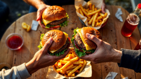 friends-enjoying-burgers-fries-picnic