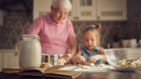 little-girl-her-grandmother-cooking-kitchen