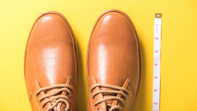 directly-shot-shoes-tape-measure-yellow-background