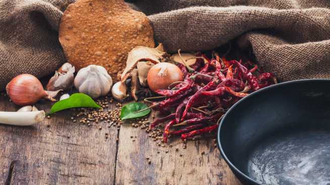various-ingredients-used-make-asian-food-are-placed-beside-pan-wooden-table