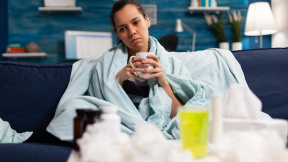 sick-caucasian-woman-sitting-bed-with-severe-cold-flu