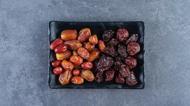 dried-plum-oleaster-plate-marble-surface