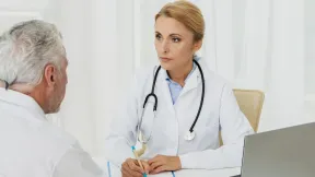 doctor-taking-notes-with-patient