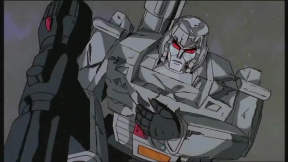 Transformers Unicron (Orson Welles) se setkává s Megatronem (Frank Welker)